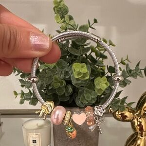 Silver Charms Bracelet with Gold and Pink Accents